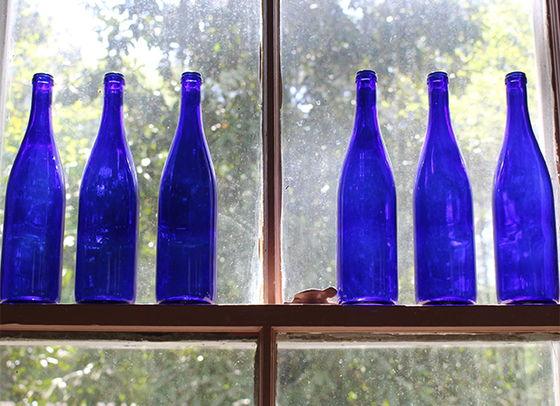 Blue bottles in a window