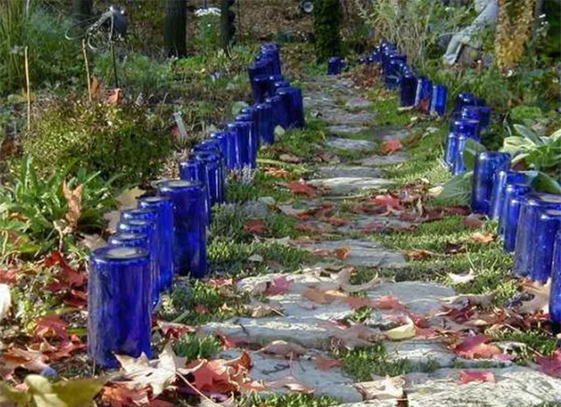 blue bottles lining a walkway